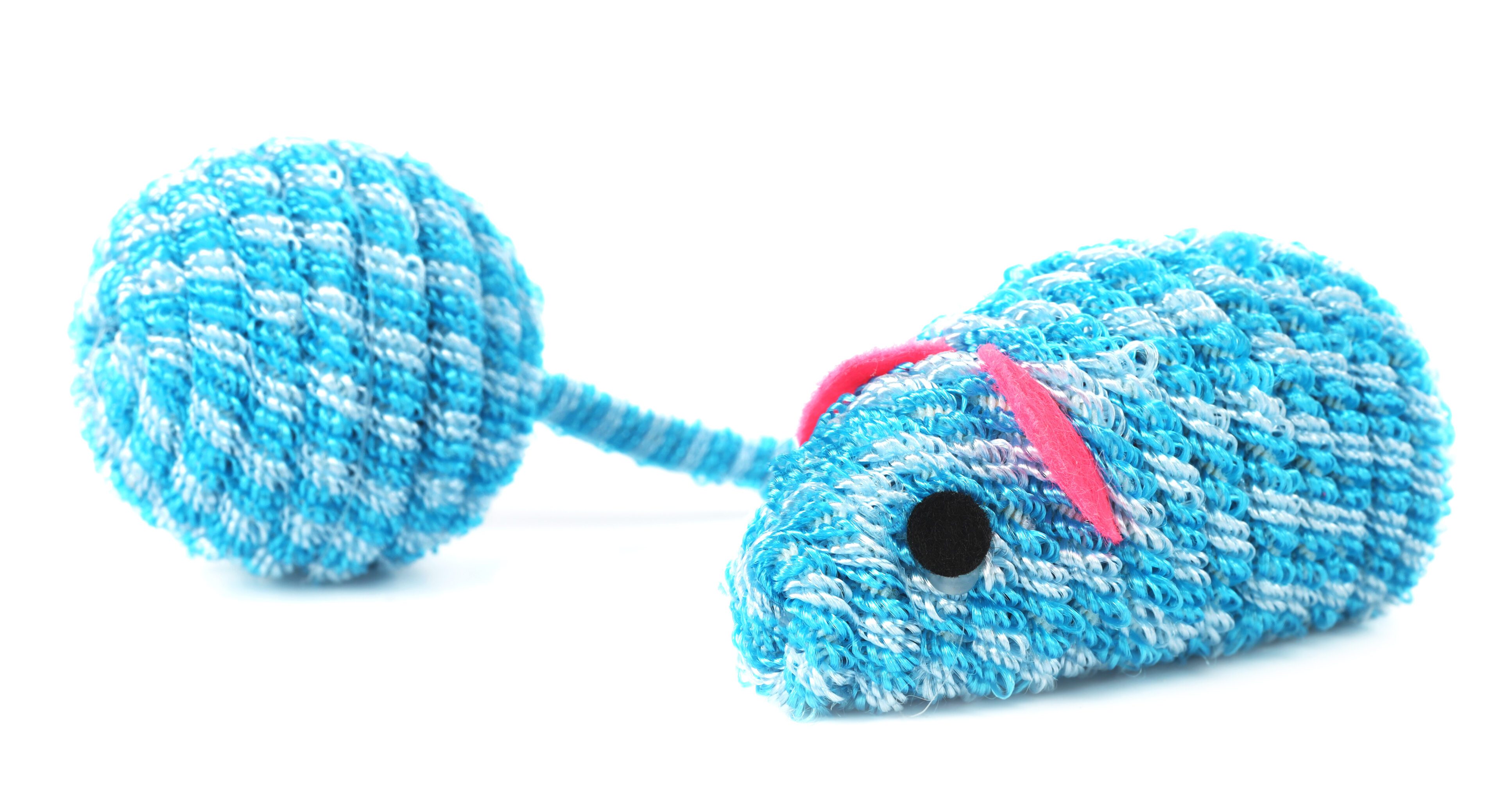 A blue and white striped toy is laying on the ground.